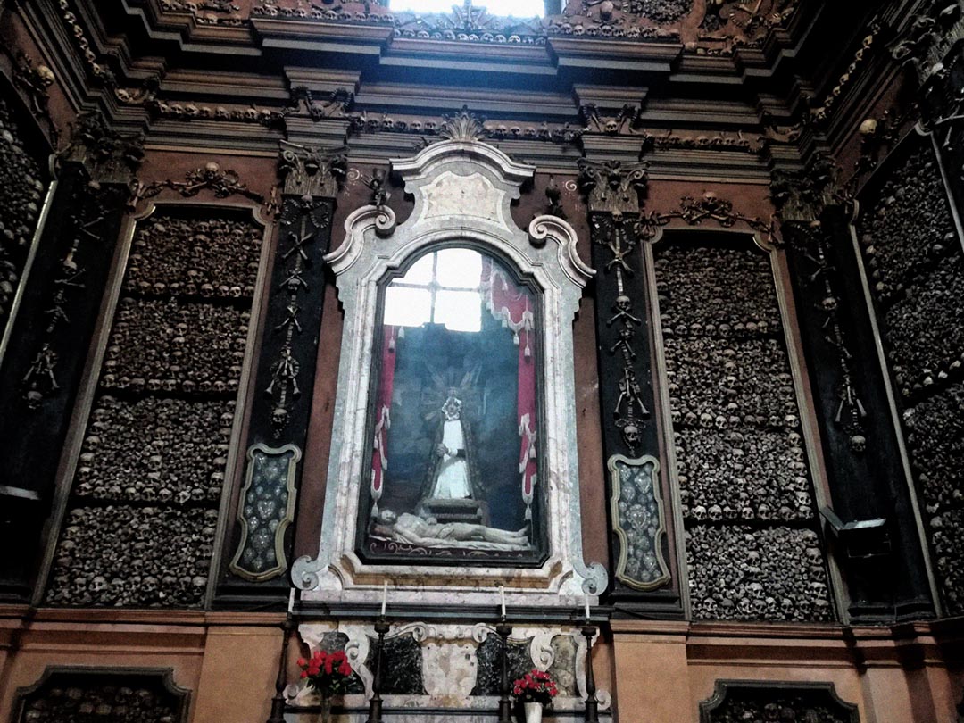 Baroque side chapels framed with skulls at San Bernardino alle Ossa in Milan